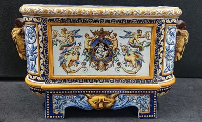 a blue and gold vase with a lion on it