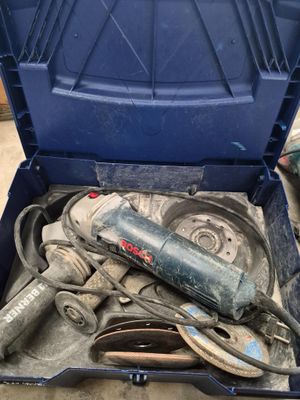 an open tool box with tools in it sitting on the floor