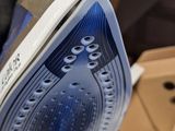 a close up of a pair of shoes with holes on the sole