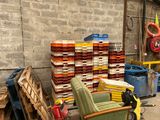 a pile of boxes and chairs in a warehouse