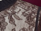 a close up of a black and white lace dress on a mannequin mannequin mannequin mannequin mannequin mannequin manne