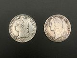 two silver coins of the same size and shape