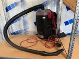 an image of a vacuum and a hose on a table
