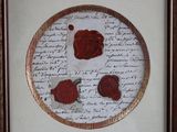 a picture of a picture of a wax seal on a piece of paper
