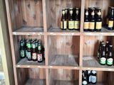 many bottles of beer on the shelves in the room