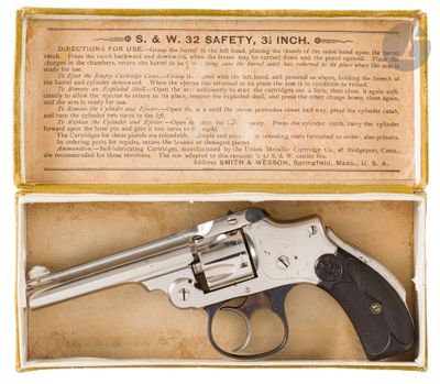a close up of a revolver in a box on a white background