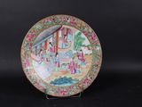 an image of a plate with a painting on it on a black surface