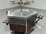 an image of a stainless steel table with a glass top