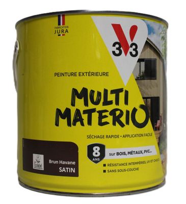 un pot de peinture jaune et noir sur fond blanc