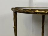 an image of a small table with a gold leaf design on it