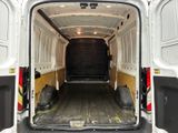 the back of a white van with the door open and the back of the van with the door open
