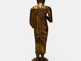 a bronze statue of a person standing on a pedestal