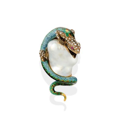 a close up of a snake ' s head with a pearl in it ' s mouth