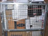 a large metal cart with many boxes on top of it