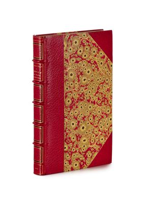 an image of a red book with gold trim and a red cover