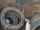 a lot of tires in the back of a truck