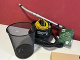 a vacuum and a cup on a table