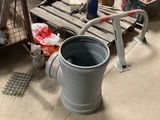 a bucket that is sitting on the floor next to some boxes