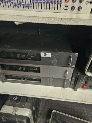 a lot of electronics that are sitting on a shelf