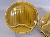 a lot of yellow plates that are sitting on a table