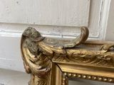 a picture of a gold frame with a bird on it