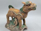 an image of a statue of a dog on a pedestal