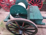 a green wagon with a red rim and a green wagon with a red rim