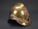 an old fireman ' s helmet on a black background