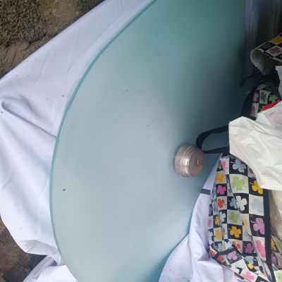 a blue table with a bag on top of it