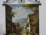 a painting hanging on the wall of a building