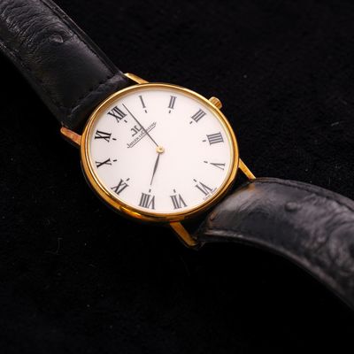 a close up of a watch with roman numerals on it