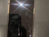 a person taking a picture of a cell phone with a camera