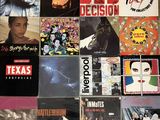 a lot of records that are on the floor