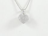 a white gold heart pendant with diamonds on a chain