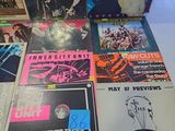 a lot of records that are on a table