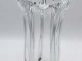 a clear glass vase on a white surface