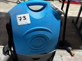 a blue and black vacuum cleaner sitting on the ground