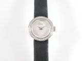 a close up of a watch on a black leather strap