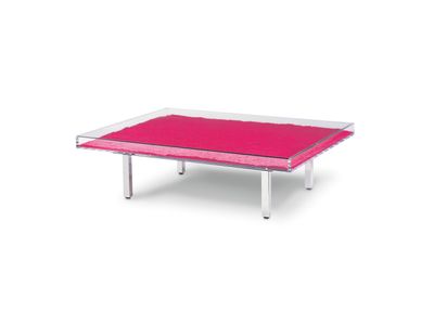 the table is made of glass and has a pink tablecloth on it