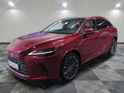 a red lex suv parked on a checkered floor in a showroom