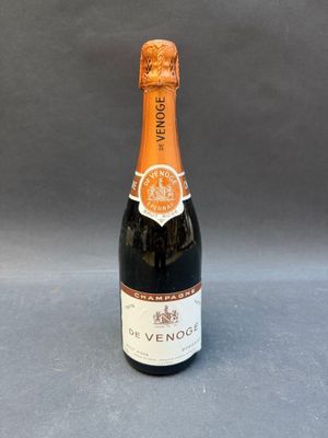 a bottle of wine that is sitting on a table