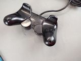 a close up of a video game controller on a table