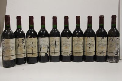 six bottles of wine are lined up in a row on a table