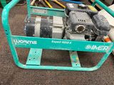 a green cart with a small engine on top of it