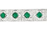 a green and white striped bracelet on a white background