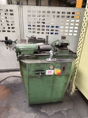a machine that is sitting on the floor next to a wall