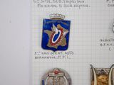 a lot of badges that are on a piece of paper