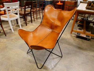 a chair that is sitting in the middle of a room