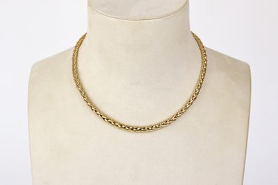 a close up of a mannequin with a necklace on it