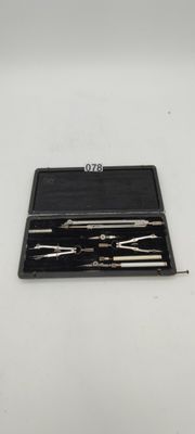 a black case with tools in it on a white surface